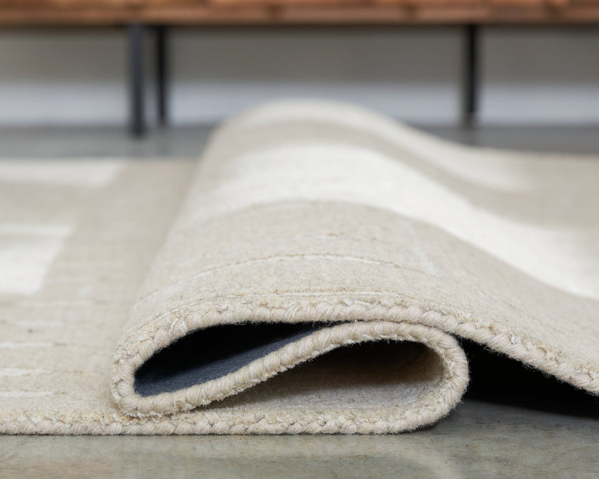 Wolbert 5' x 7' Area Rug - Faith Furniture (Manhattan, KS)