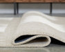 Wolbert 5' x 7' Area Rug - Faith Furniture (Manhattan, KS)